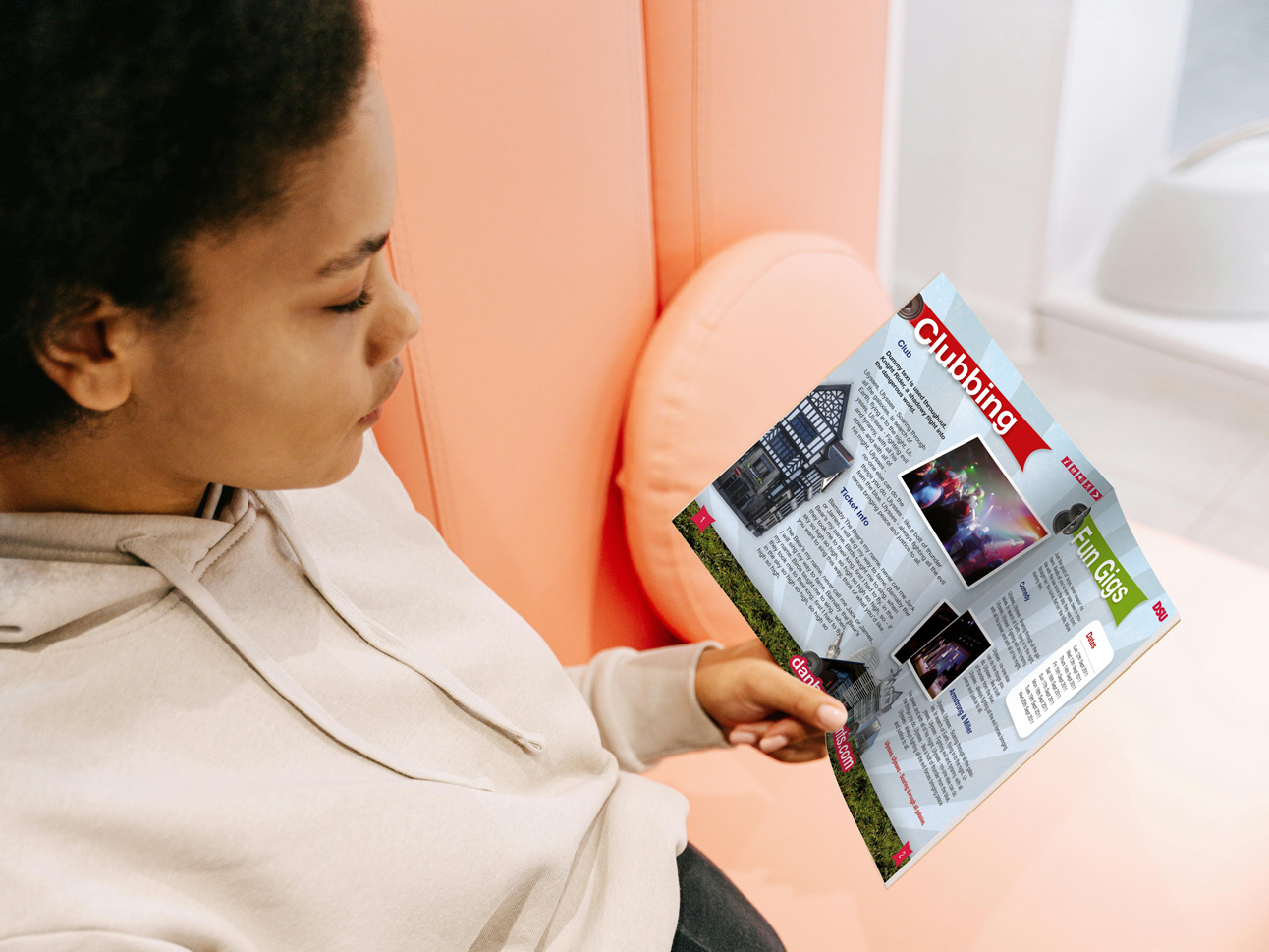 Student looking at the inside of brochure guide